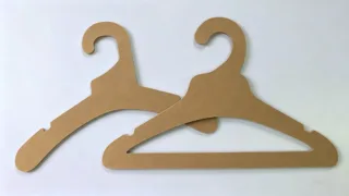 Kraft paper garment hanger made from laminated kraft paperboard for sustainable clothing display and retail use