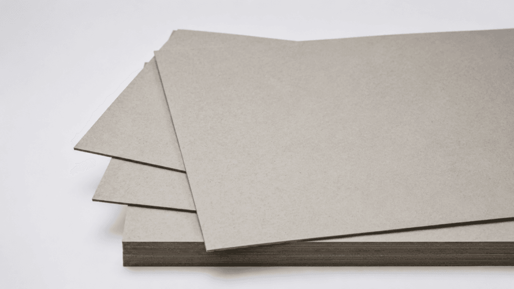 High gloss laminated paperboard with stable laminated structure for rigid packaging