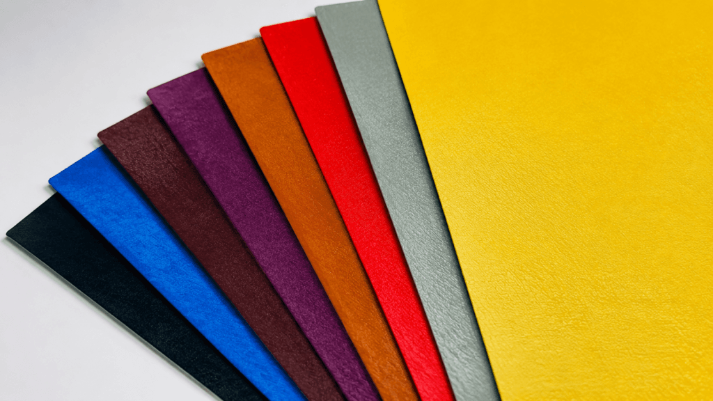 Specialty paper sheets with unique textures for premium packaging applications