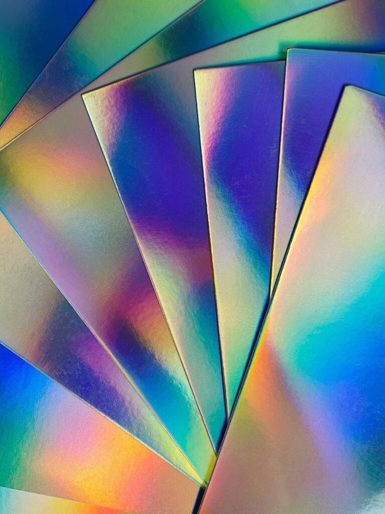 Gold metallic paperboard close-up showing smooth reflective surface.