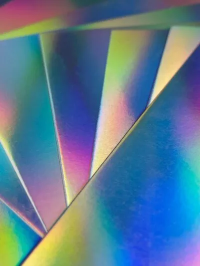 Silver metallic coated paperboard sheet with glossy finish.