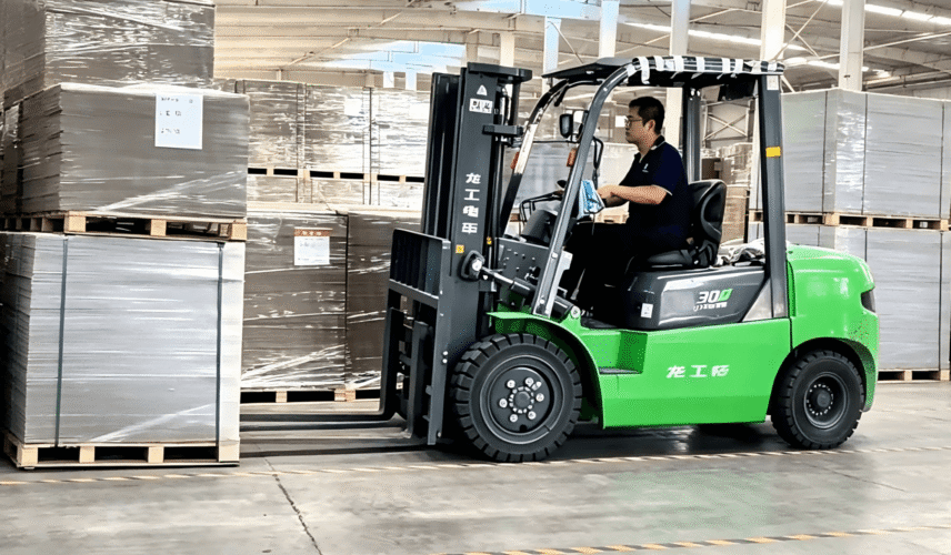 Chinese grey board supplier warehouse, forklift handling stacked grey cardboard sheets for fast delivery, industrial packaging material production facility