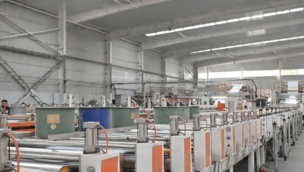 Professional composite grey board drying and setting production line in the workshop of China laminated grey board manufacturer hongtuscenery, showcasing large-scale industrial packaging material manufacturing equipment