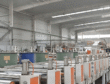 Professional composite grey board drying and setting production line in the workshop of China laminated grey board manufacturer hongtuscenery, showcasing large-scale industrial packaging material manufacturing equipment