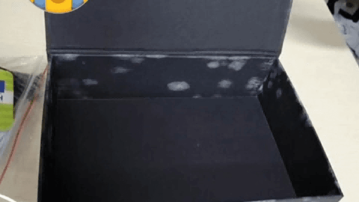 Moldy rigid gift box damaged by moisture during storage or transportation