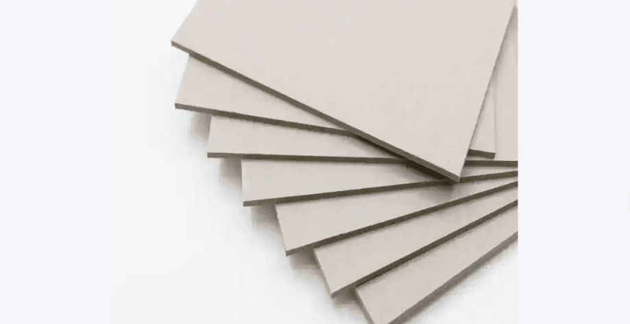 Laminated composite greyboard sheets stacked in packaging factory for rigid gift box production