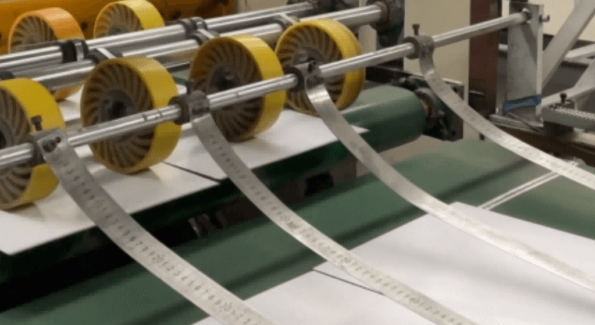 Greyboard production line showing industrial manufacturing process of recycled paperboard used for luxury rigid gift box packaging.