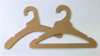 Kraft paper garment hanger made from laminated kraft paperboard for sustainable clothing display and retail use