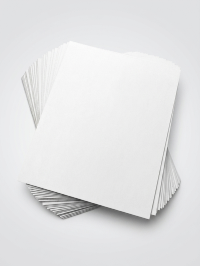 White Lined Chipboard (WLC) sheets stacked in different cut sizes for packaging paperboard applications