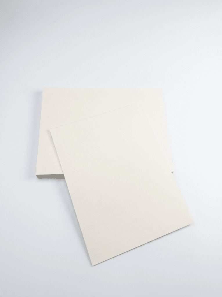 Premium SBS Paperboard sheets stacked in warehouse for luxury packaging and printing applications