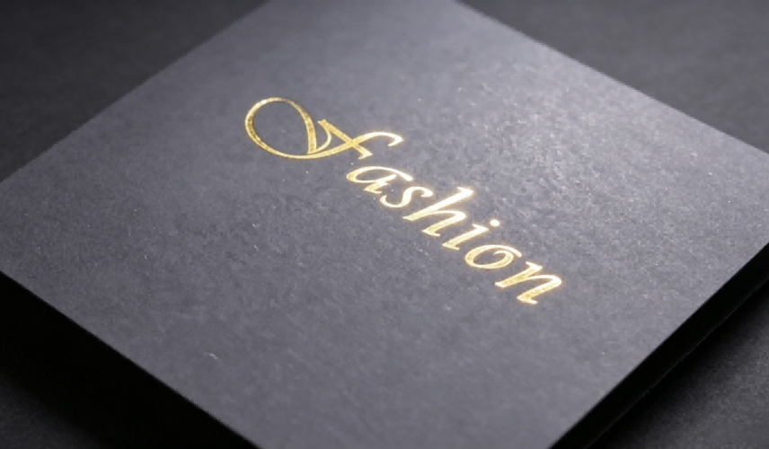Gold hot foil stamping on solid black paperboard, luxury packaging material sample Gold hot foil stamping on solid black paperboard, luxury packaging material sample