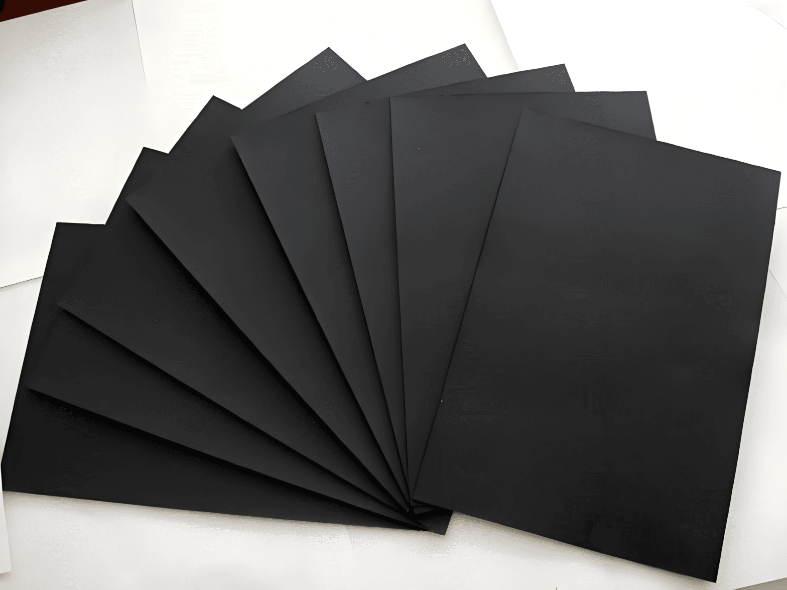 Black Paperboard sheet unrolled for packaging and printing applications