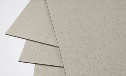 Premium high gloss laminated paperboard sheets arranged for luxury box packaging application.