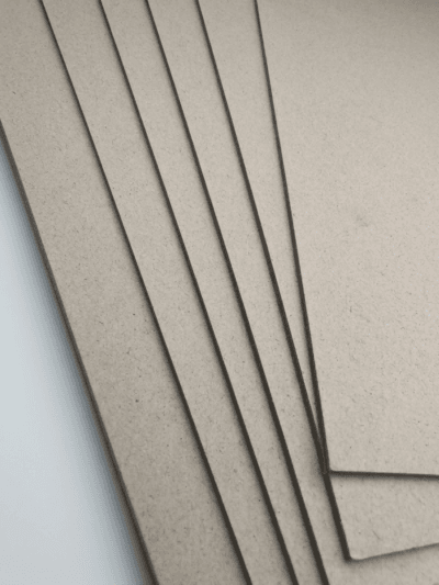 Side view of rigid high gloss laminated paperboard highlighting thickness and durable structure.
