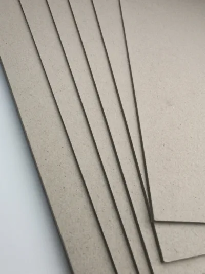 Side view of rigid high gloss laminated paperboard highlighting thickness and durable structure.